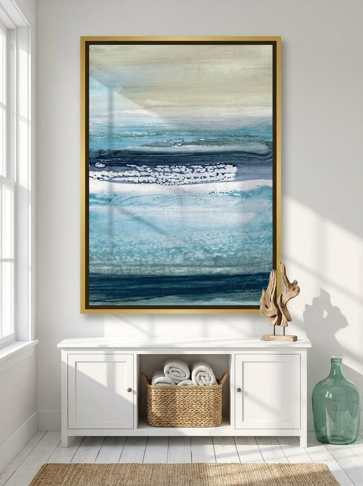 Oversized statement canvas wall art with a gold leaf surround styled on the wall in a coastal bathroom