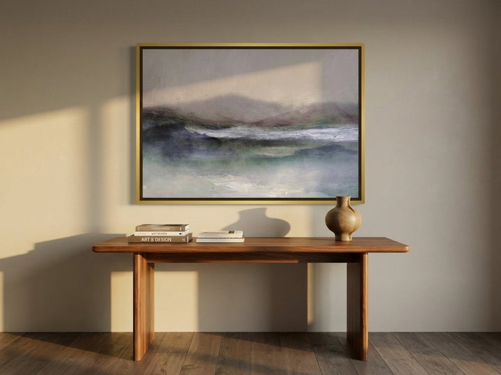 Canvas wall art with a gold leaf surround styled on the wall in a luxe home office