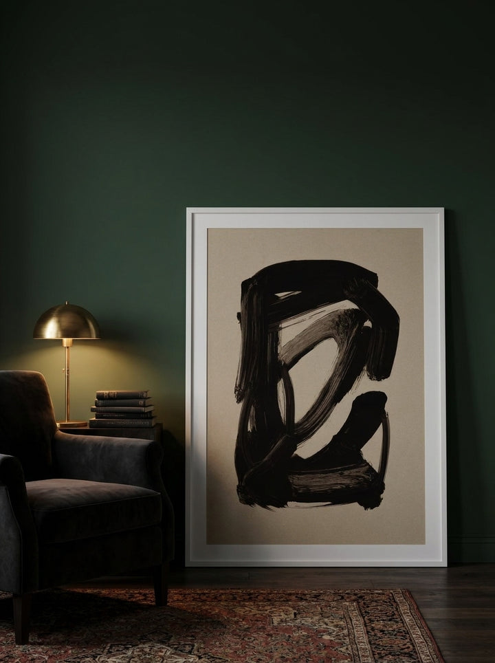 Modern wall art print leaning against the wall in a moody bedroom