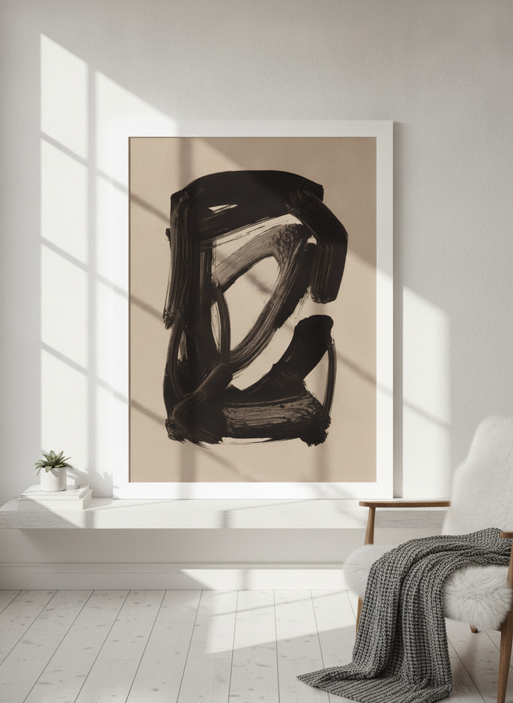 Modern wall art print standing on a shelf in a bright Scandinavian home office