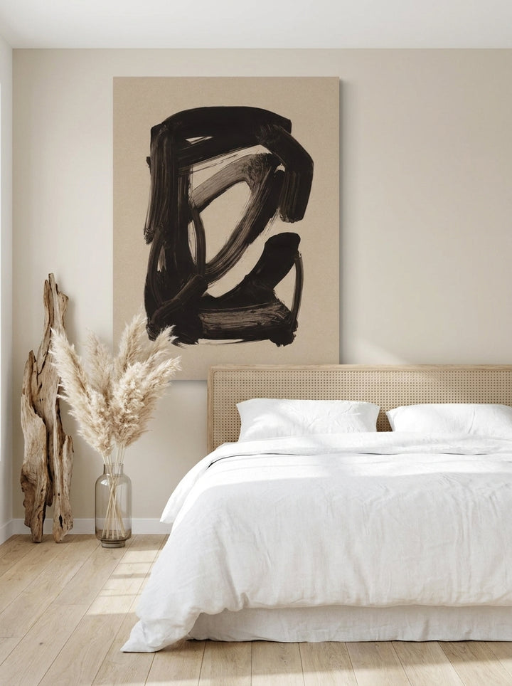 Stretched canvas wall art styled on the wall in a coastal bedroom