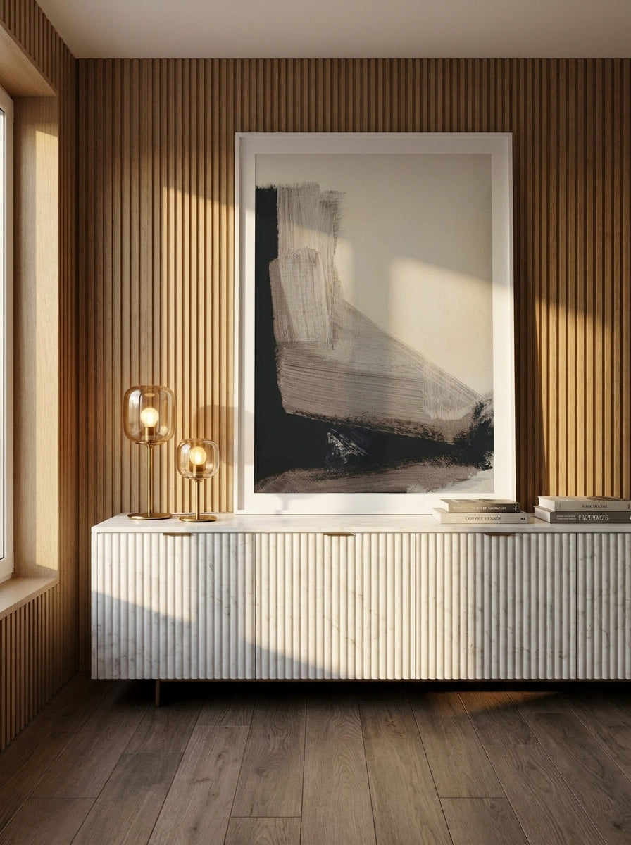 Modern wall art print standing on a sideboard in a luxe bedroom