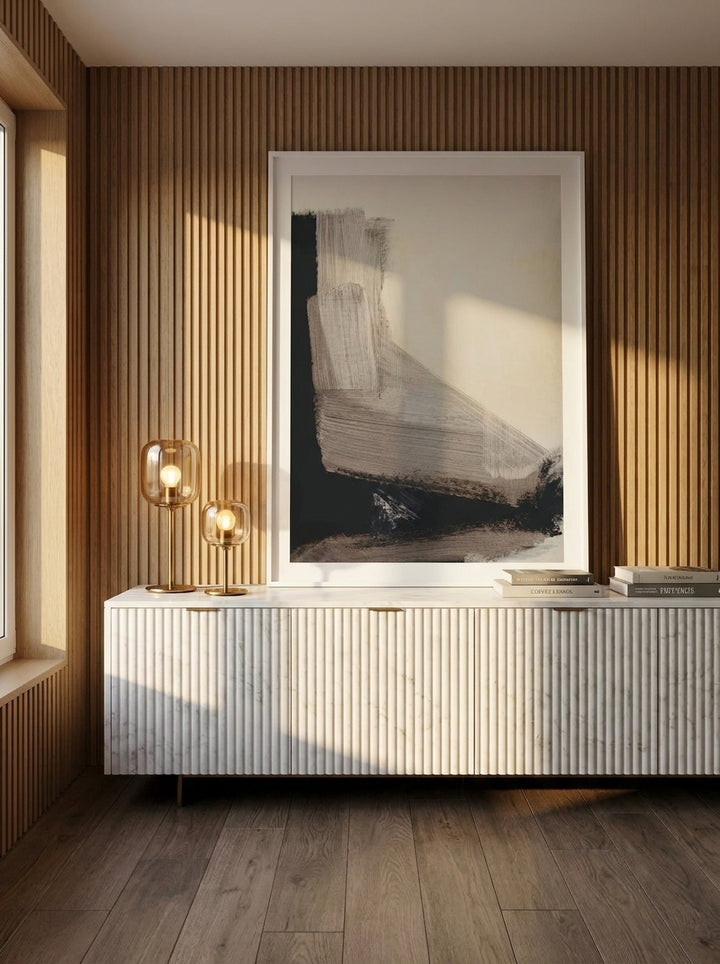 Modern wall art print standing on a sideboard in a luxe bedroom