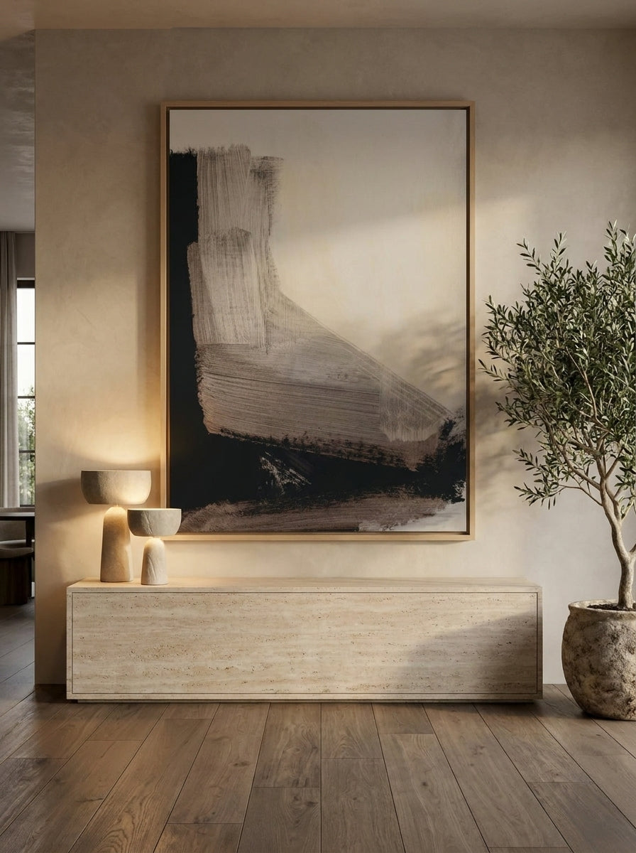 Oversized statement canvas wall art with a natural timber surround styled on the wall in a luxe living room