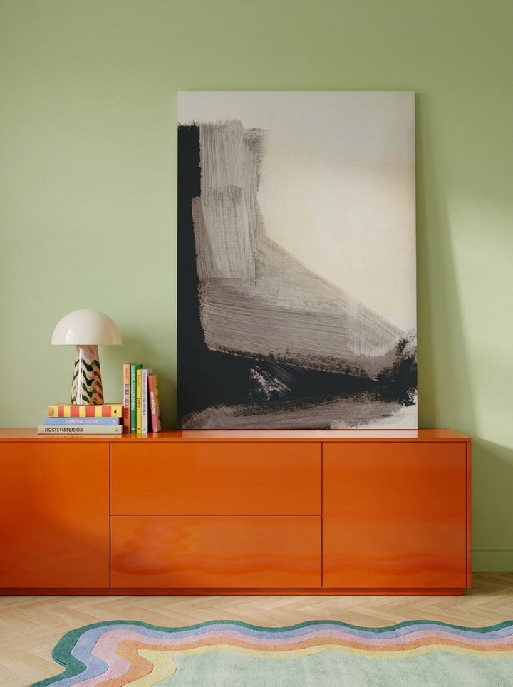 Stretched canvas wall art standing on a sideboard in a colourful eclectic bedroom
