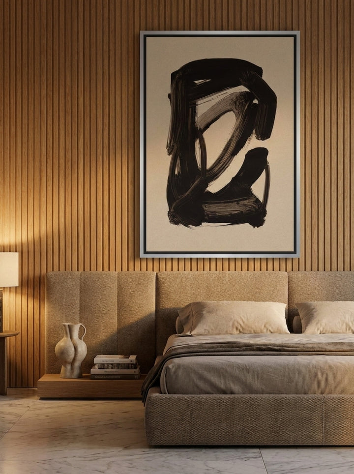 Oversized statement canvas wall art with a silver leaf surround styled on the wall in a luxe bedroom