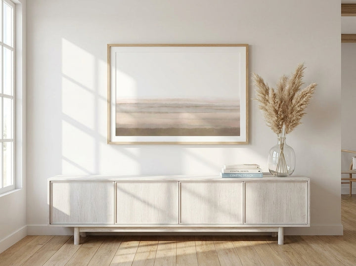 Modern wall art print styled on the wall in a coastal living room