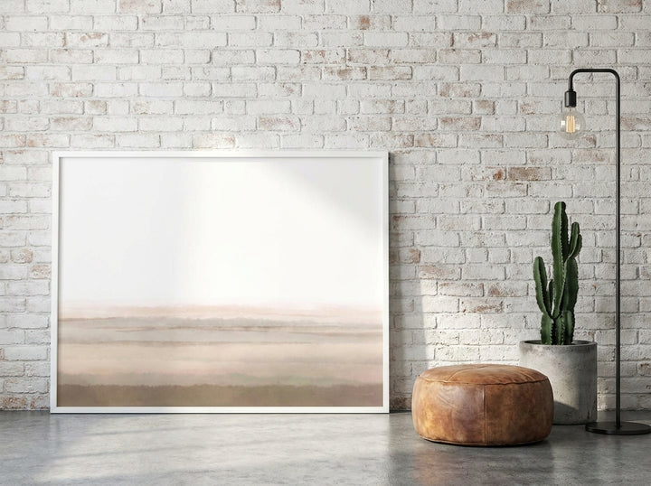 Canvas wall art with a white surround leaning against the wall in an industrial loft bedroom
