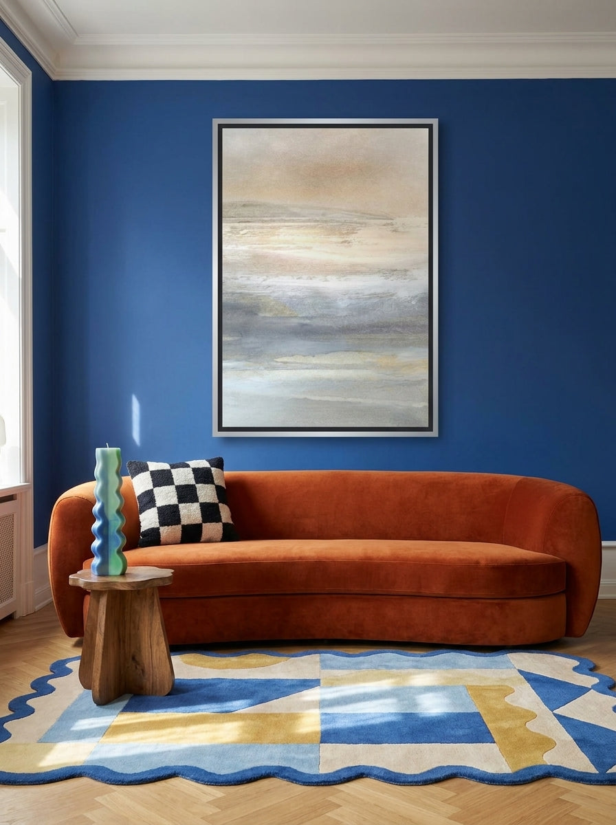 Oversized statement canvas wall art with a silver leaf surround styled on the wall in a colourful eclectic living room