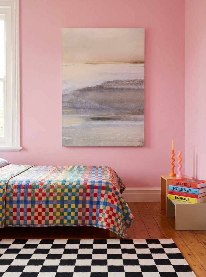 Stretched canvas wall art styled on the wall in a colourful eclectic bedroom