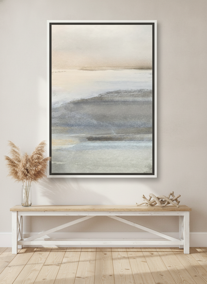 Oversized statement canvas wall art with a white surround styled on the wall in a coastal living room
