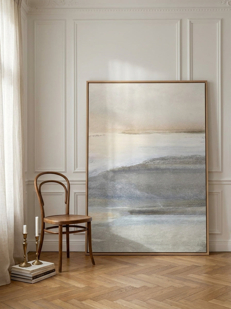 Oversized statement canvas wall art with a natural timber surround leaning against the wall in a Parisian bathroom