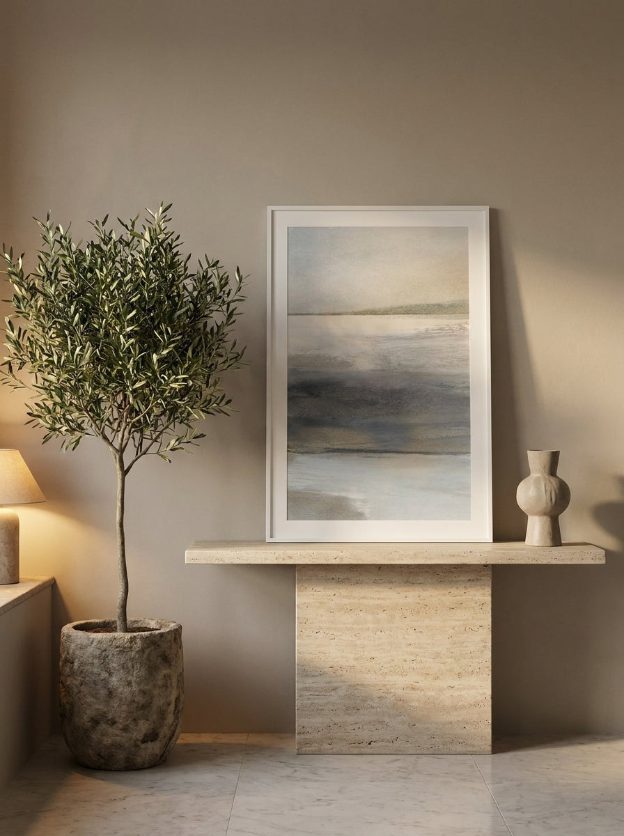 Modern wall art print standing on a console in a luxe bedroom