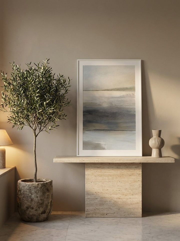 Modern wall art print standing on a console in a luxe bedroom