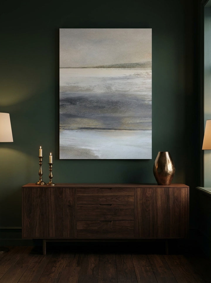 Stretched canvas wall art styled on the wall in a moody living room