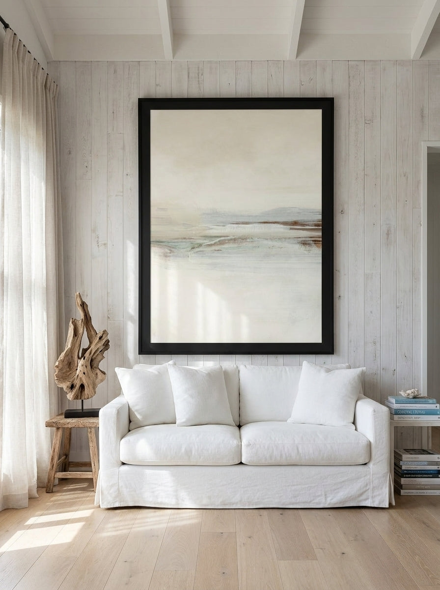 Oversized statement modern wall art print styled on the wall in a coastal living room
