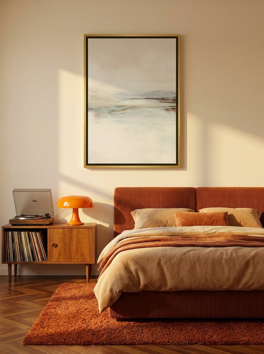 Canvas wall art with a gold leaf surround styled on the wall in a retro 70s bedroom