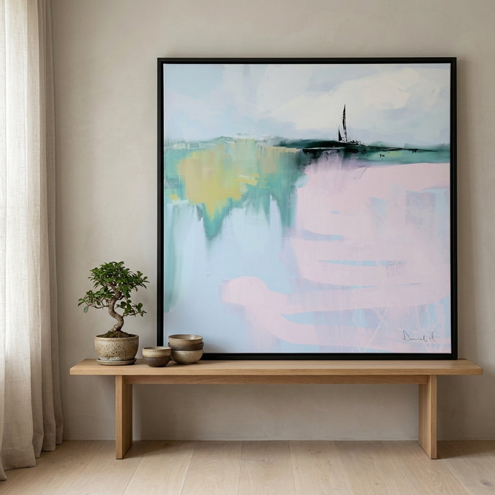 Canvas wall art with a black surround standing on a bench in a warm Japandi home office