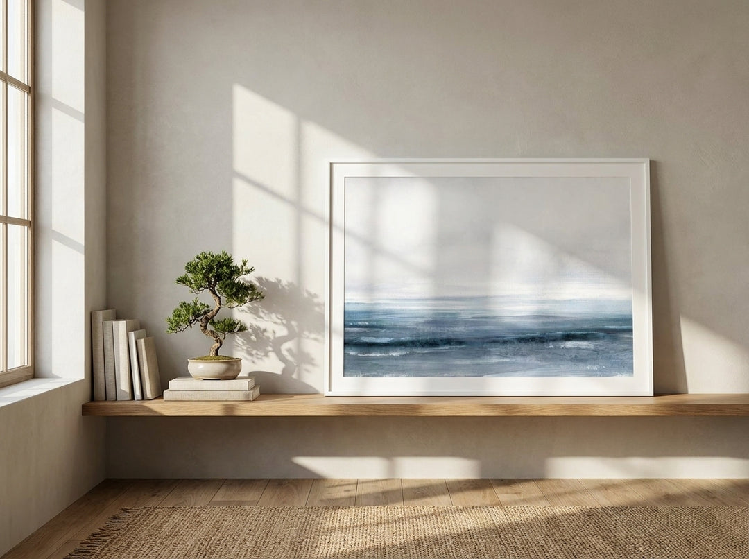 Modern wall art print standing on a shelf in a warm Japandi home office
