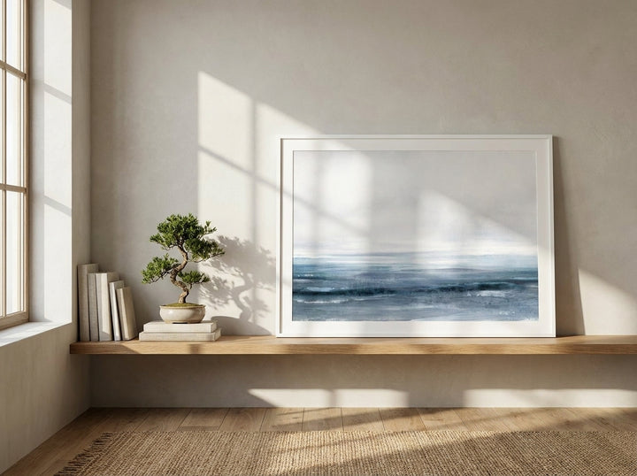 Modern wall art print standing on a shelf in a warm Japandi home office