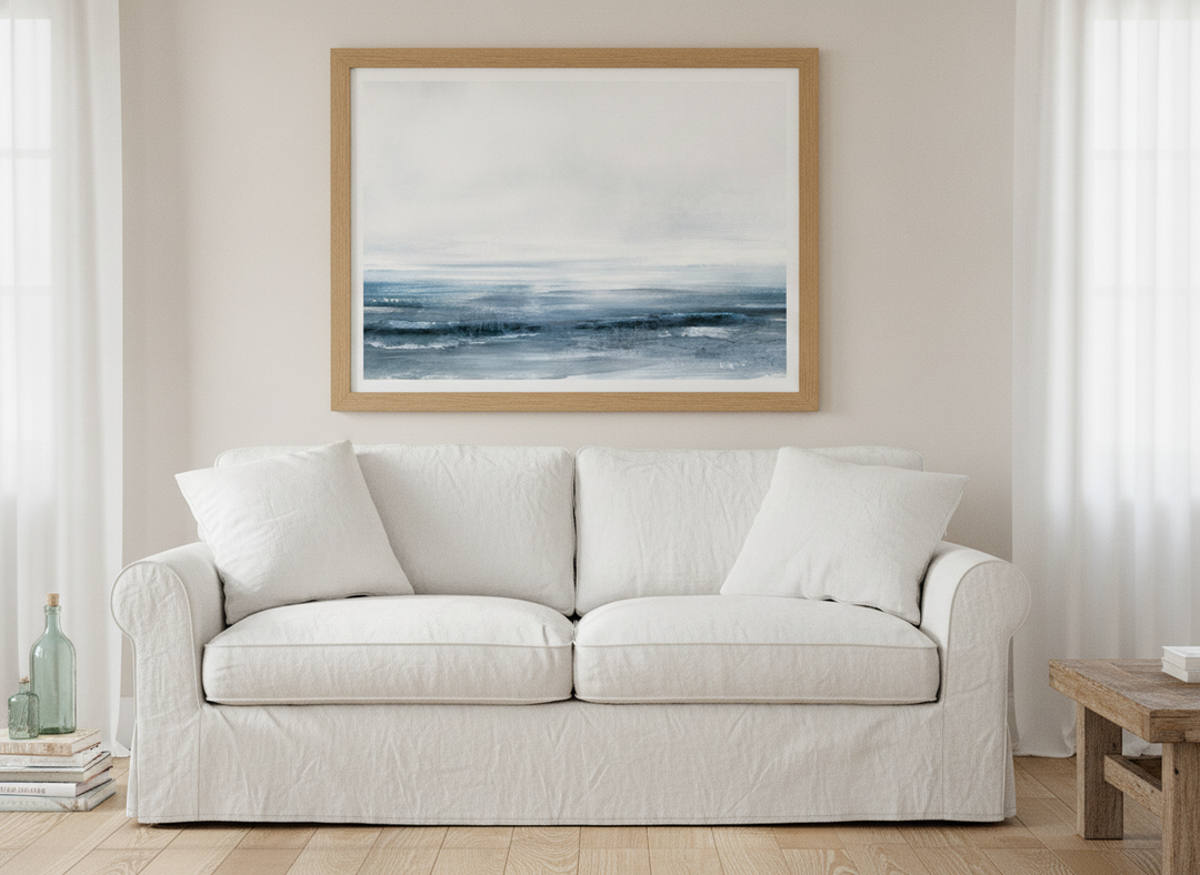 Modern wall art print styled on the wall in a coastal living room