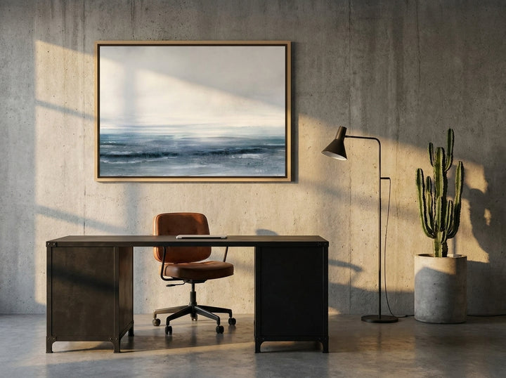 Canvas wall art with a natural timber surround styled on the wall in an industrial loft home office
