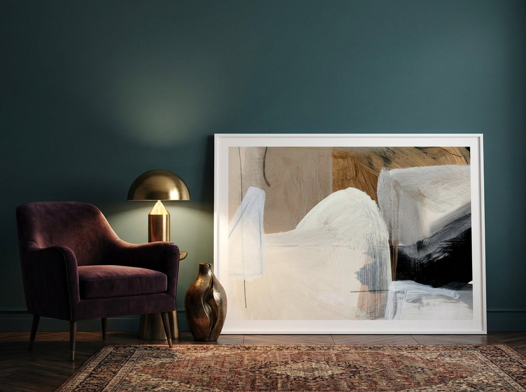 Modern wall art print leaning against the wall in a moody bedroom