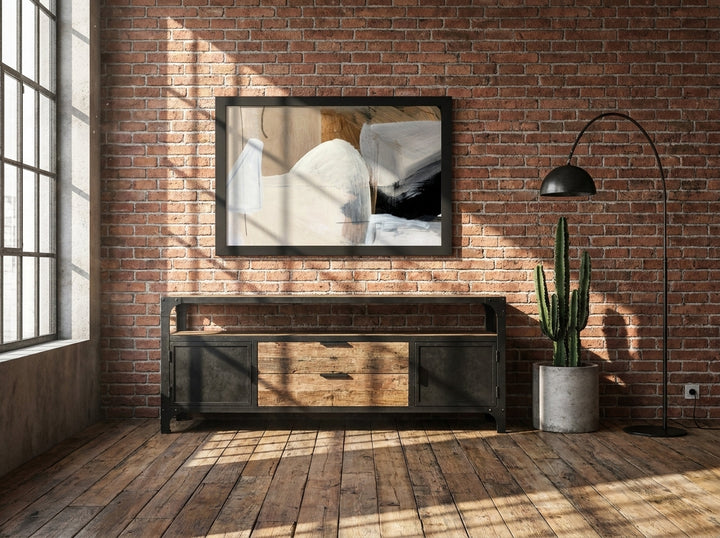 Modern wall art print styled on the wall in an industrial loft living room