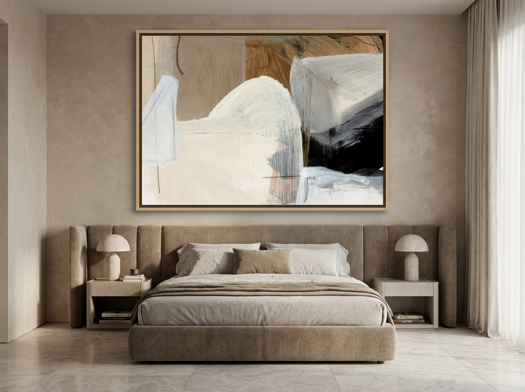 Oversized statement canvas wall art with a natural timber surround styled on the wall in a luxe bedroom