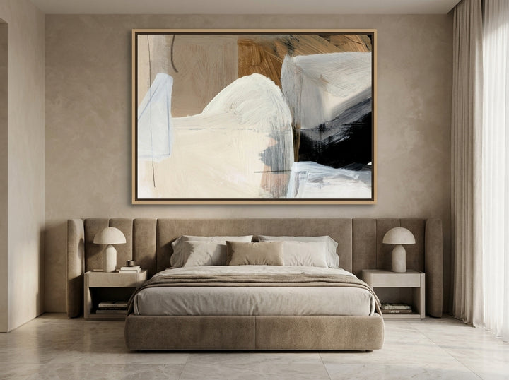 Oversized statement canvas wall art with a natural timber surround styled on the wall in a luxe bedroom