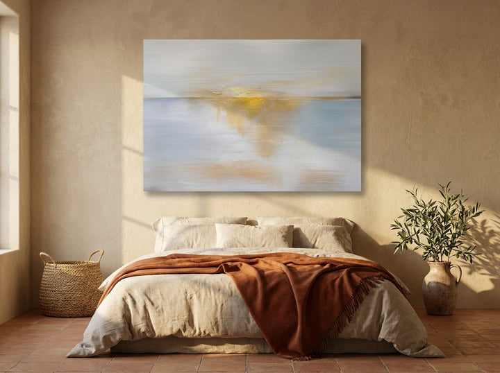 Stretched canvas wall art styled on the wall in a Mediterranean bedroom