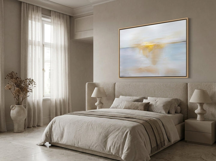 Oversized statement canvas wall art with a natural timber surround styled on the wall in a luxe bedroom
