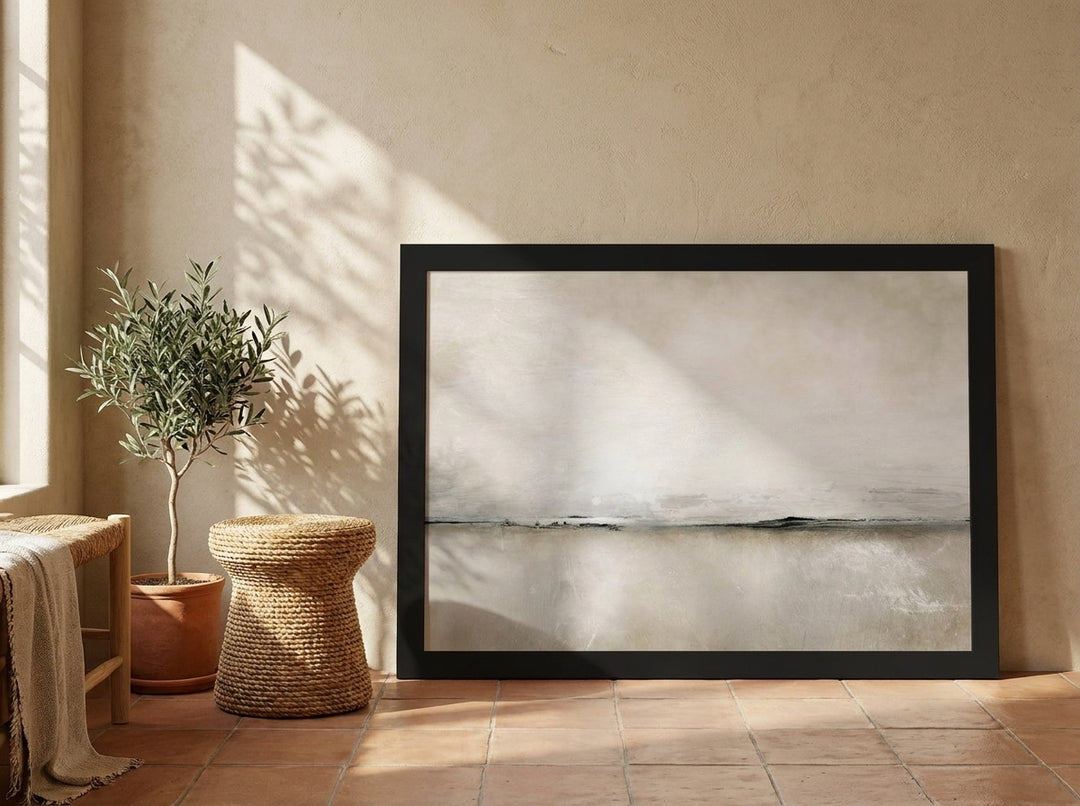 Modern wall art print leaning against the wall in a Mediterranean living room
