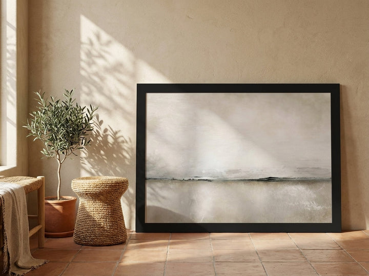 Modern wall art print leaning against the wall in a Mediterranean living room