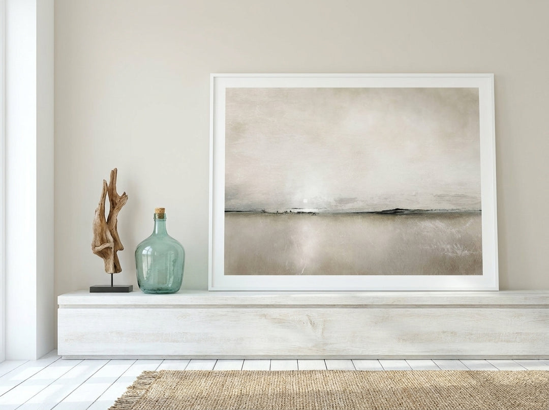 Modern wall art print standing on a console in a coastal home office