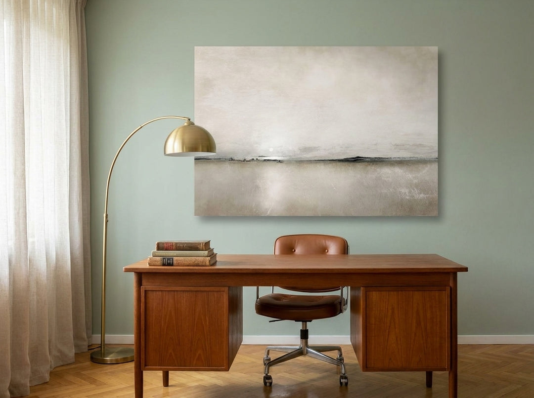 Stretched canvas wall art styled on the wall in a mid-century home office