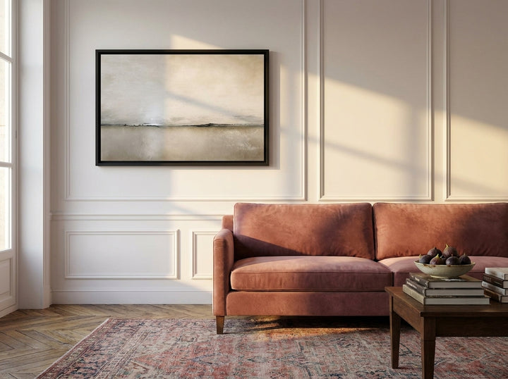 Canvas wall art with a black surround styled on the wall in a Parisian living room