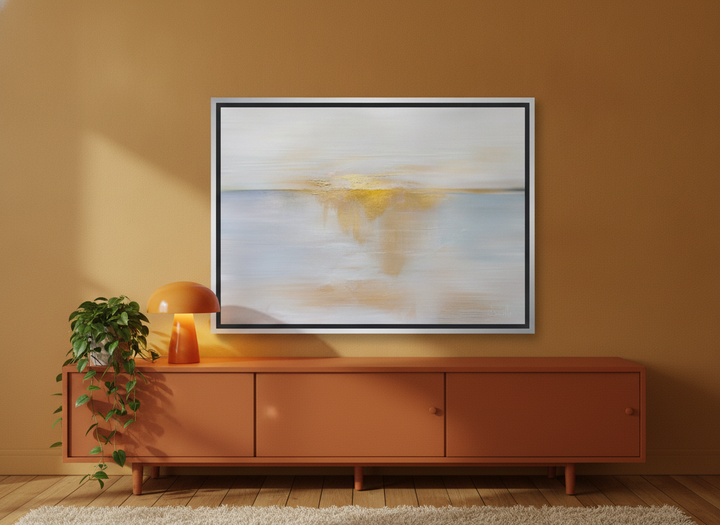 Canvas wall art with a silver leaf surround standing on a sideboard in a retro 70s bedroom