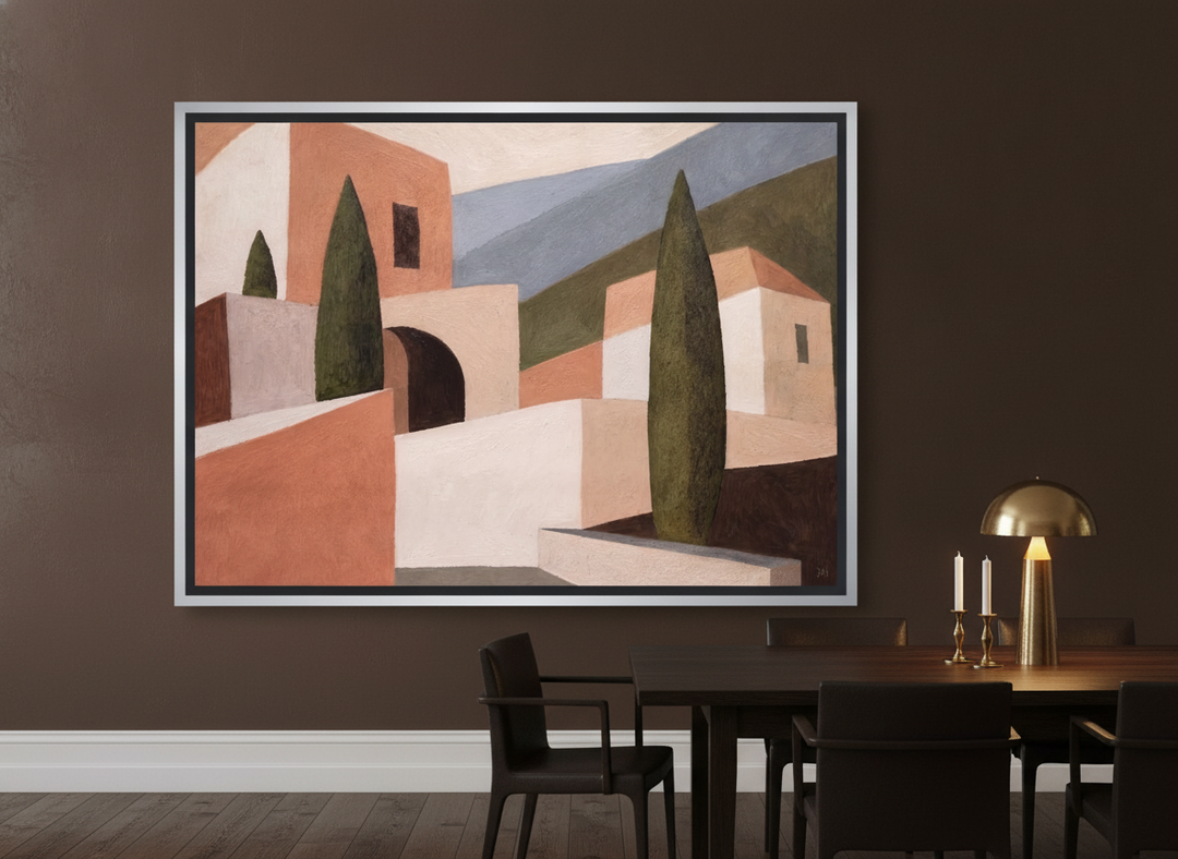 Oversized statement canvas wall art with a silver leaf surround styled on the wall in a moody dining room