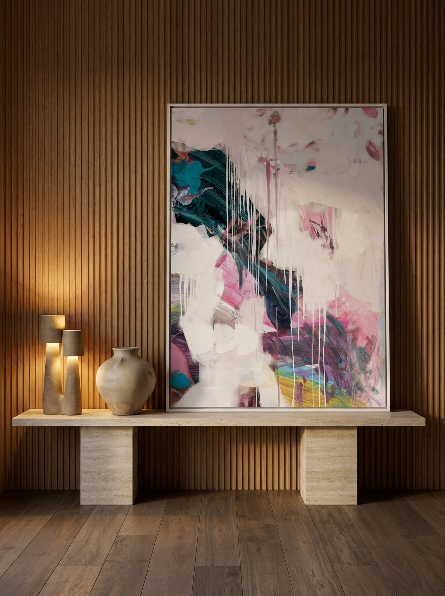 Canvas wall art with a white surround standing on a console in a luxe dining room