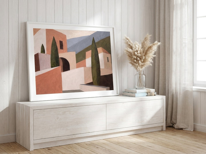 Modern wall art print standing on a console in a coastal home office