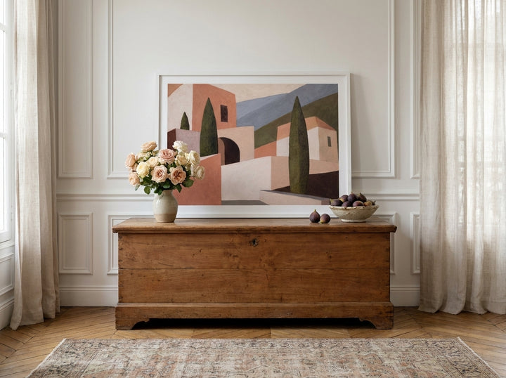 Modern wall art print standing on a sideboard in a Parisian living room