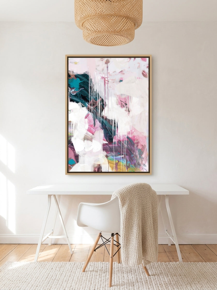 Canvas wall art with a natural timber surround styled on the wall in a bright Scandinavian home office