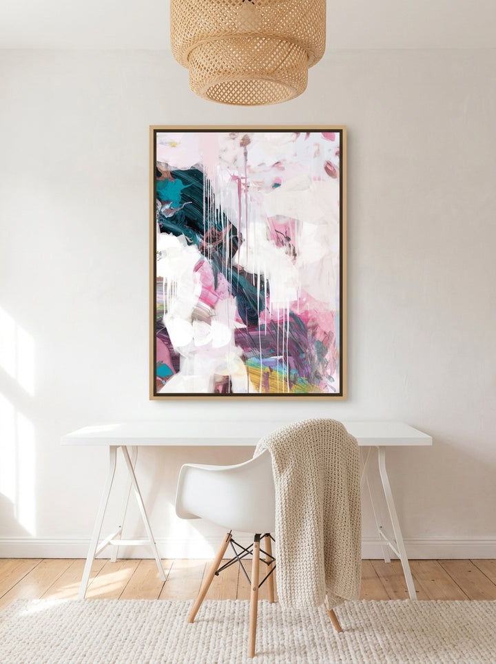Canvas wall art with a natural timber surround styled on the wall in a bright Scandinavian home office