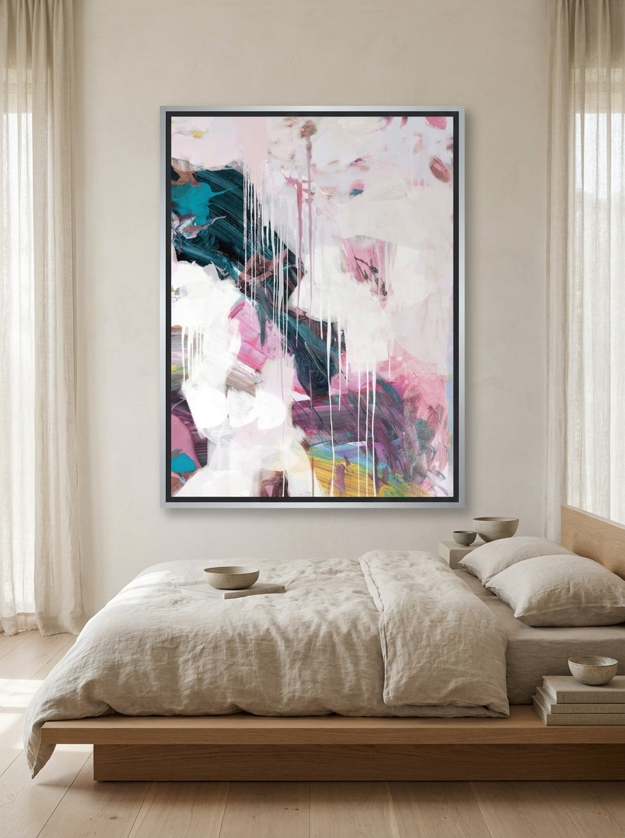 Canvas wall art with a silver leaf surround styled on the wall in a warm Japandi bedroom