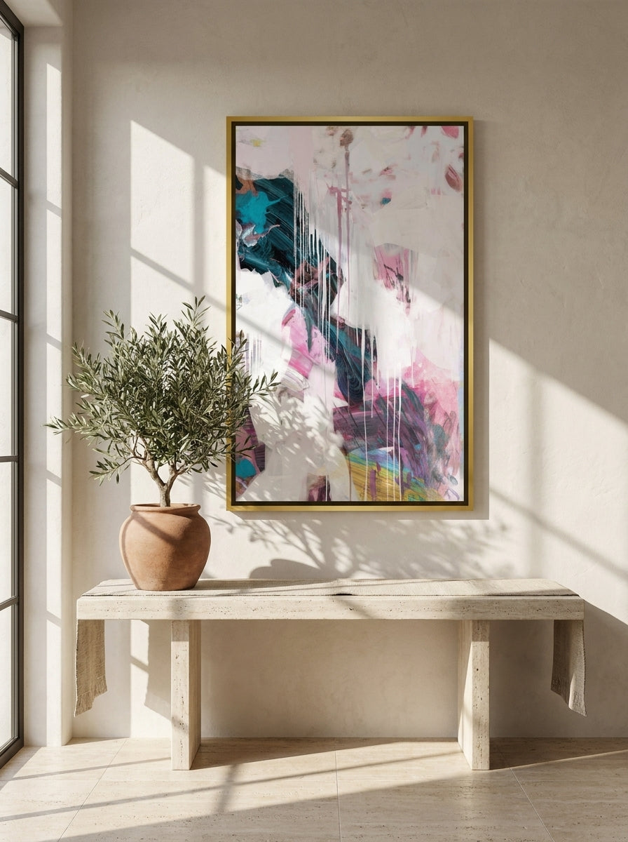 Oversized statement canvas wall art with a gold leaf surround styled on the wall in a Mediterranean living room