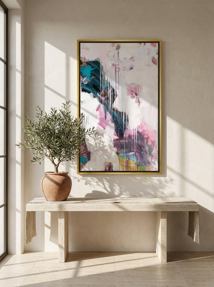Oversized statement canvas wall art with a gold leaf surround styled on the wall in a Mediterranean living room