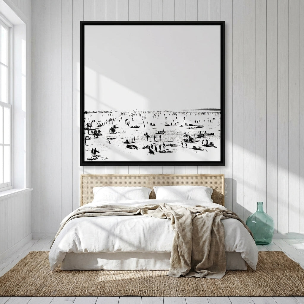 Oversized statement canvas wall art with a black surround styled on the wall in a coastal bedroom