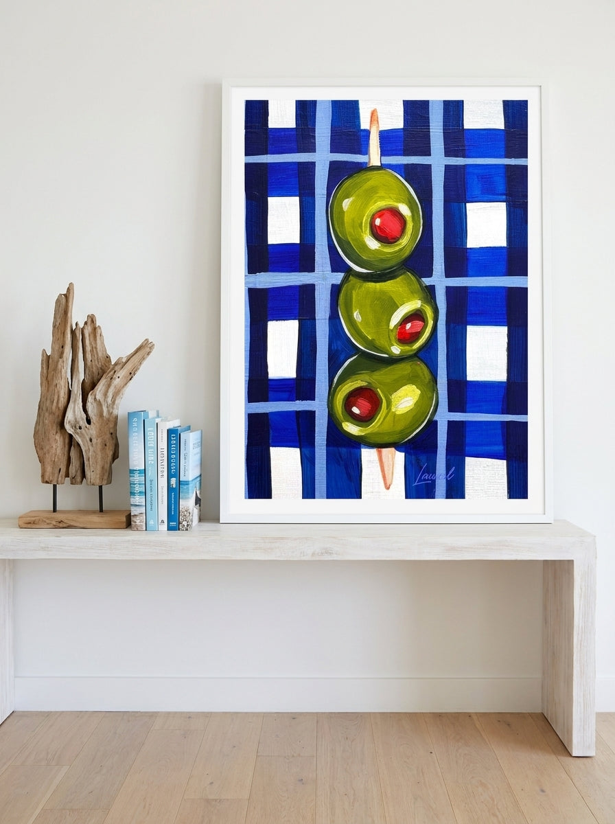 Modern wall art print standing on a console in a coastal living room