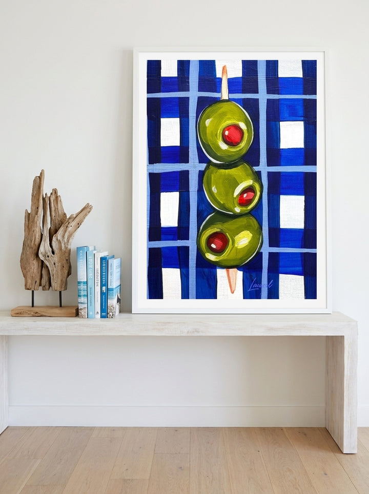 Modern wall art print standing on a console in a coastal living room
